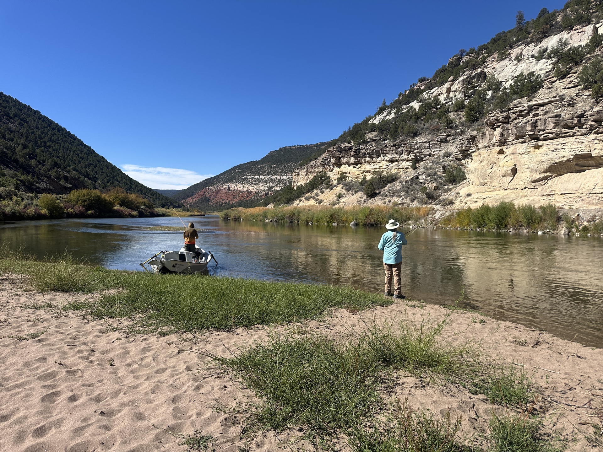Anglers fly fishing on a stunning Colorado canyon river